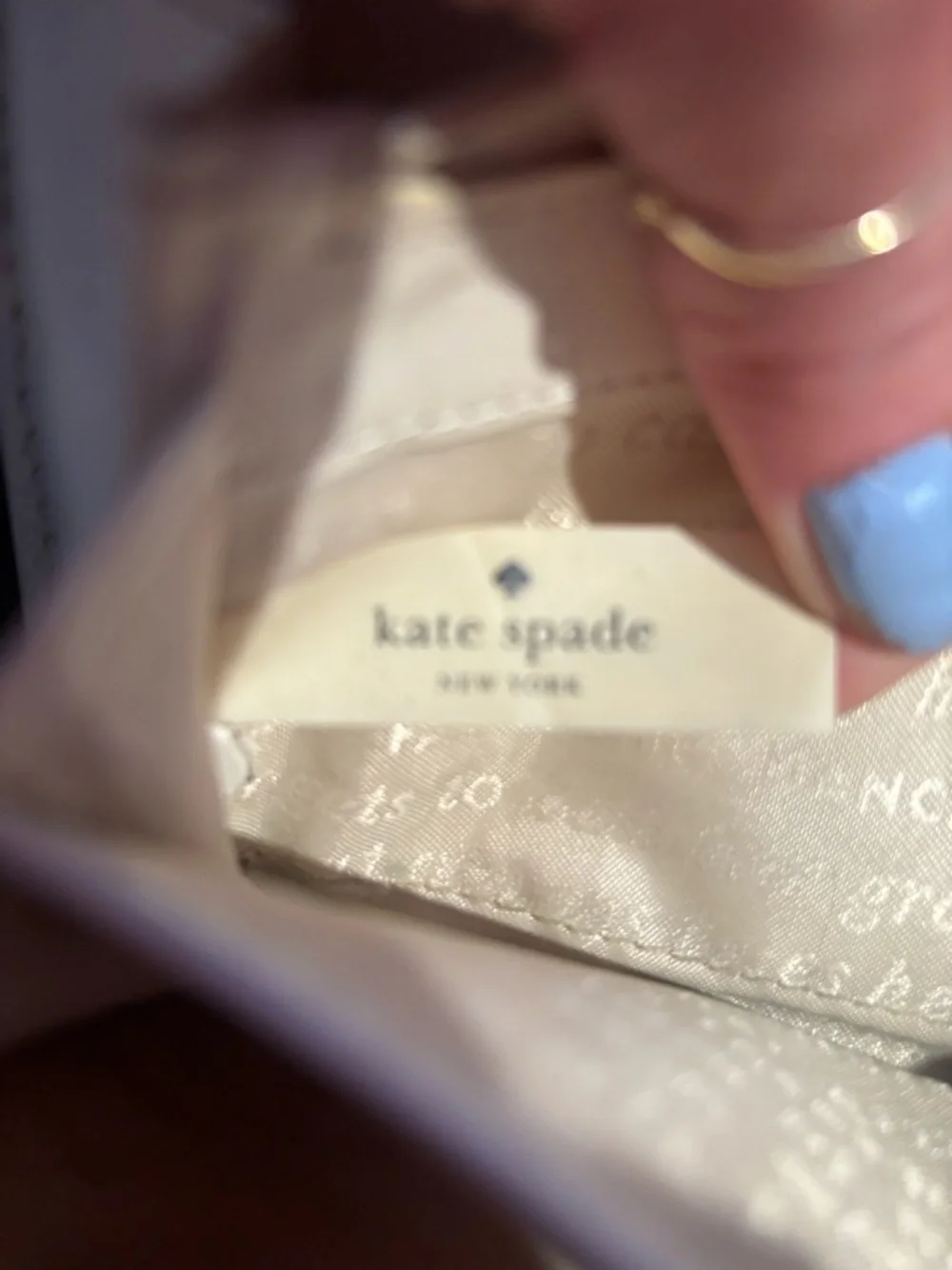 grey Kate Spade Beacon Court patent leather wallet